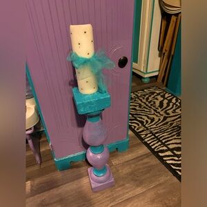 Candleholder painted turquoise and pinkish purple color